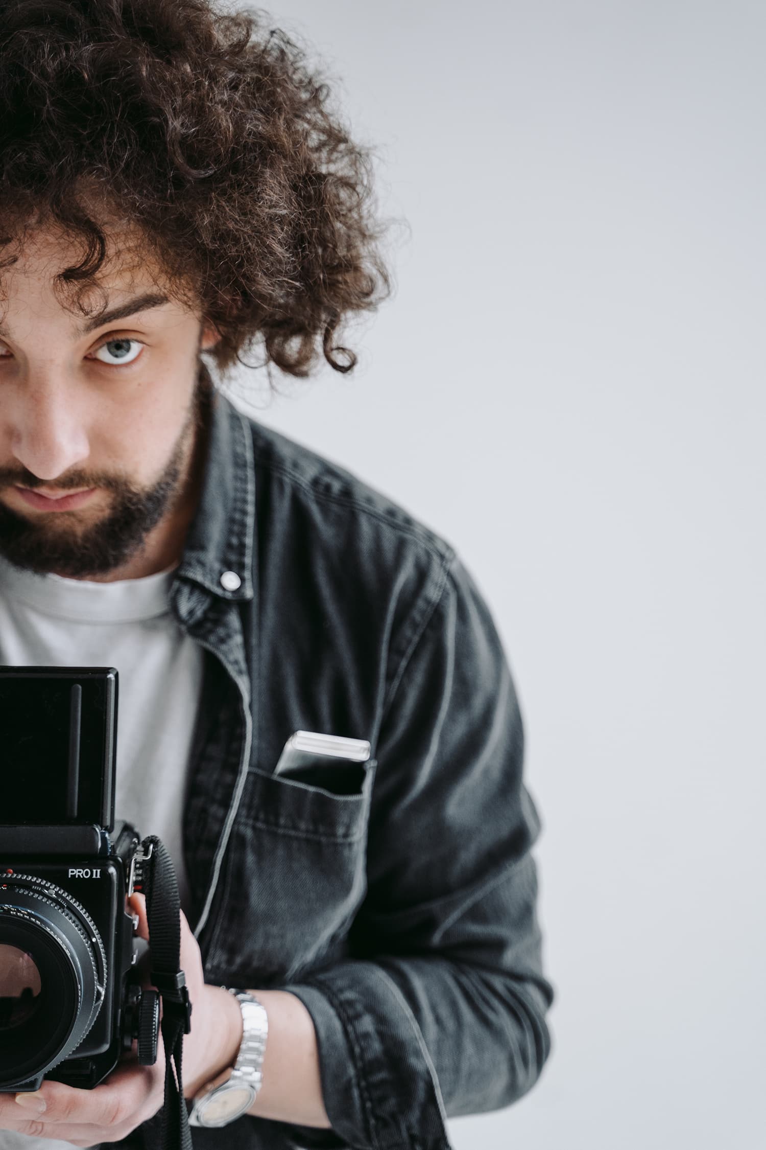 Close-up of a professional photographer with his camera