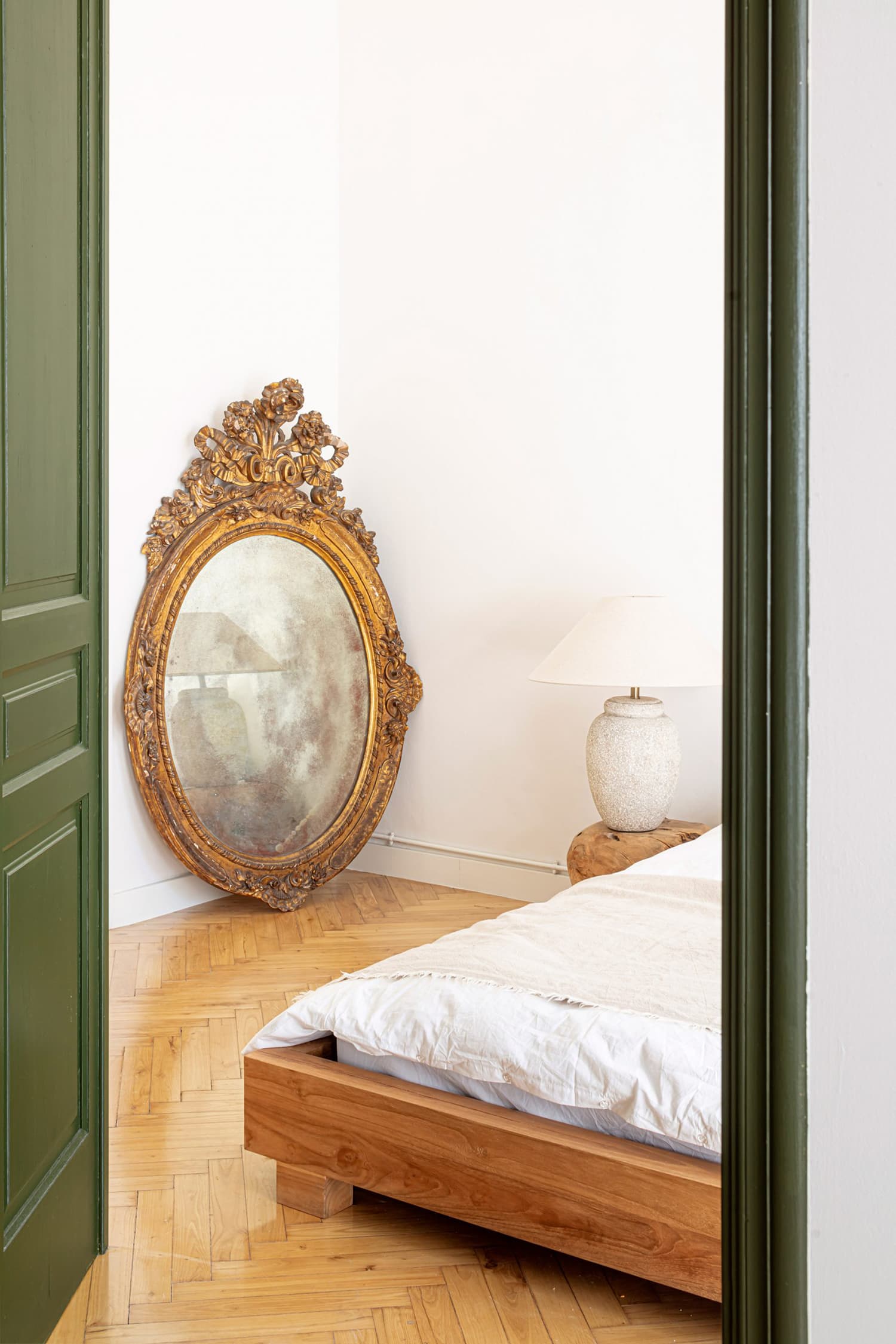 Antique gold baroque framed mirror in bedroom