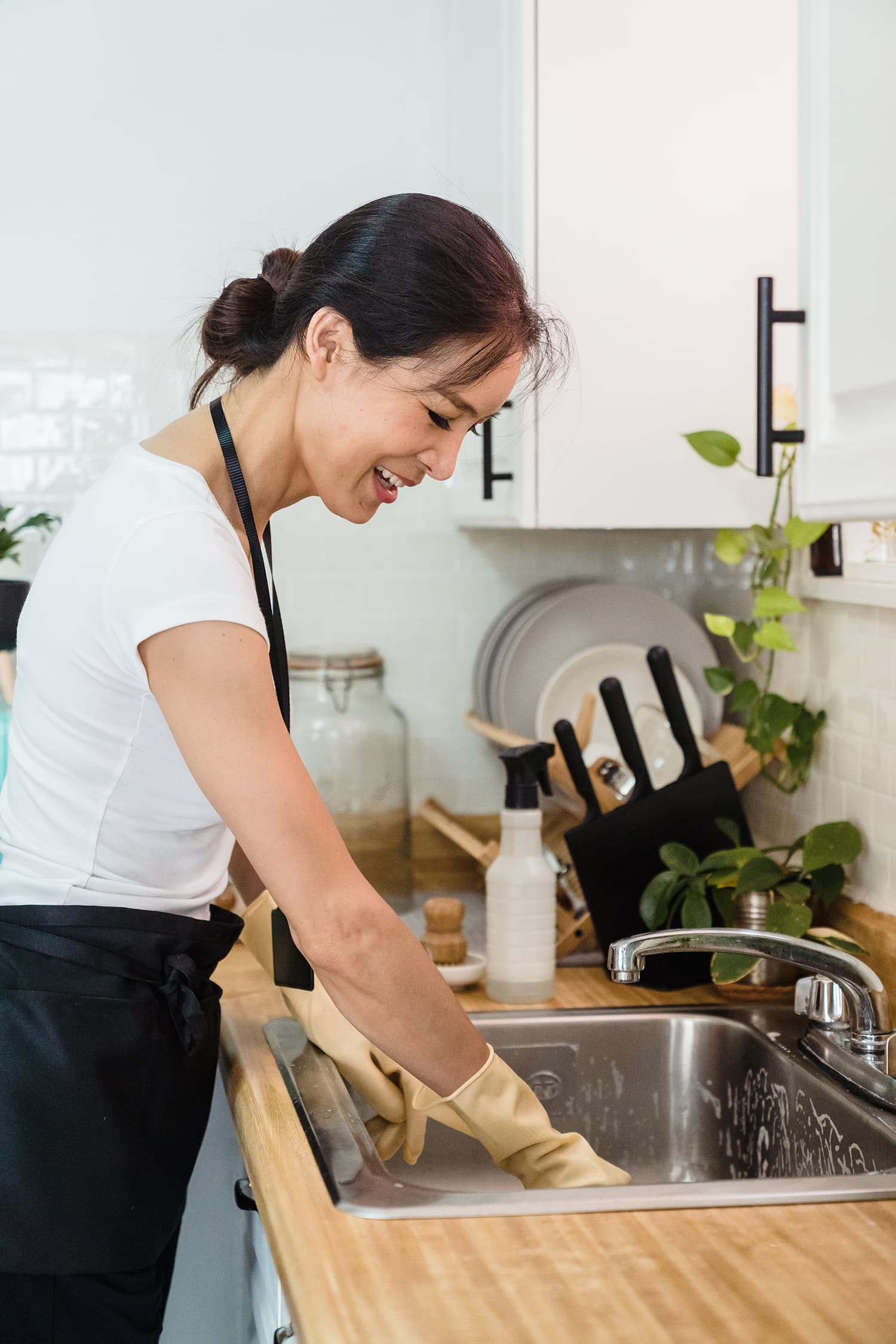 Woman cleaning the kitchen sink