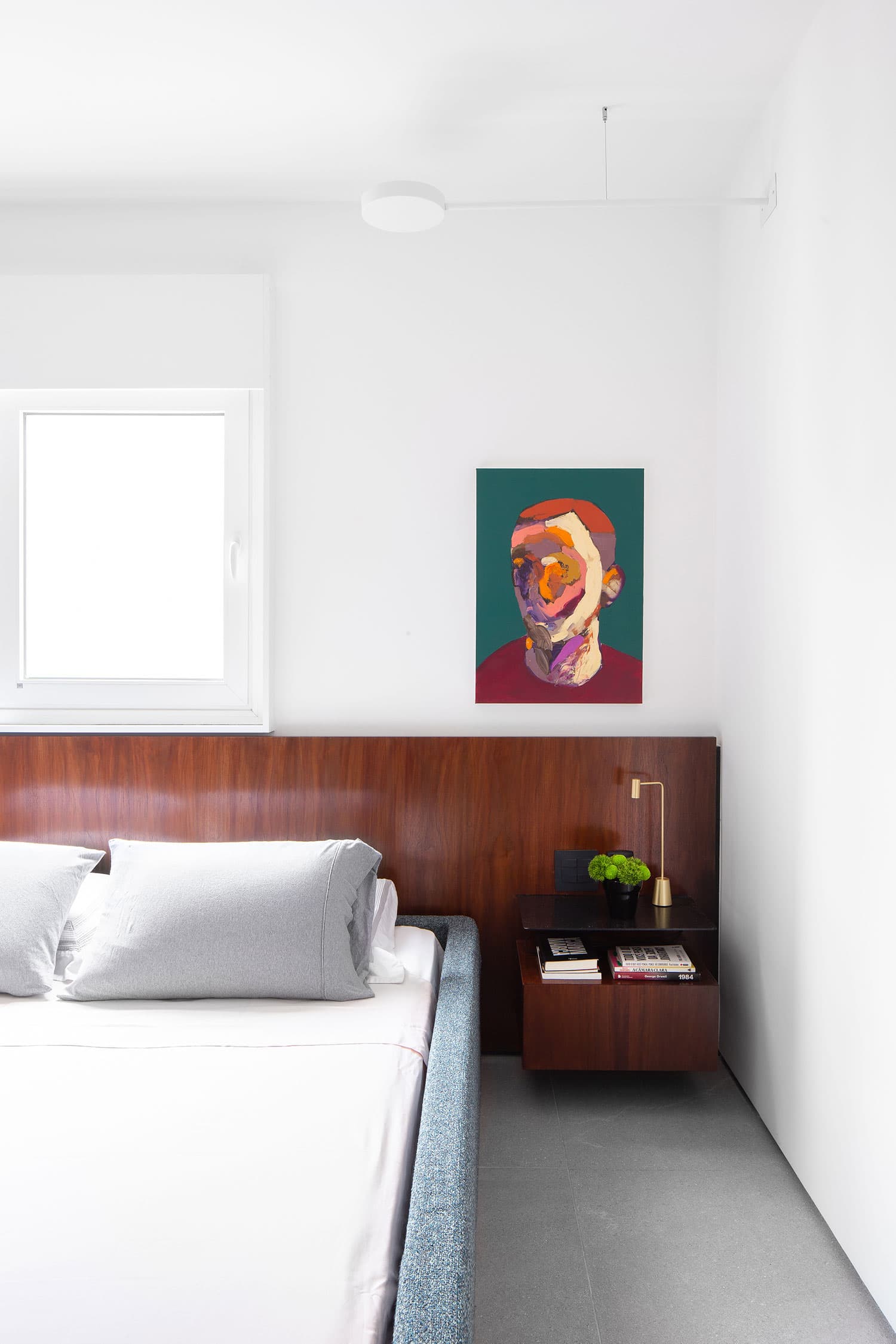 Canvas print depicting a stylized face in the bedroom